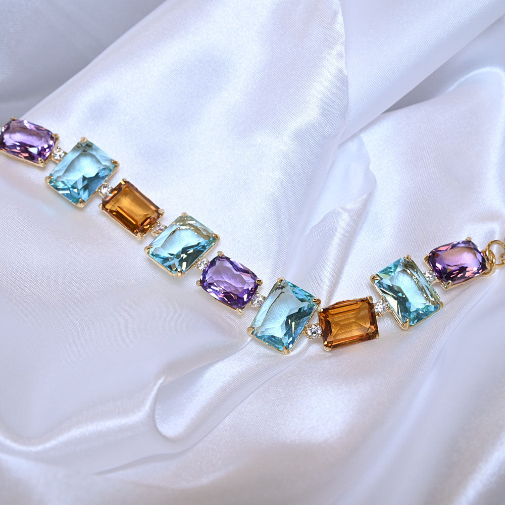 Bracciale in Argento dorato con quarzi colorati e zirconi
