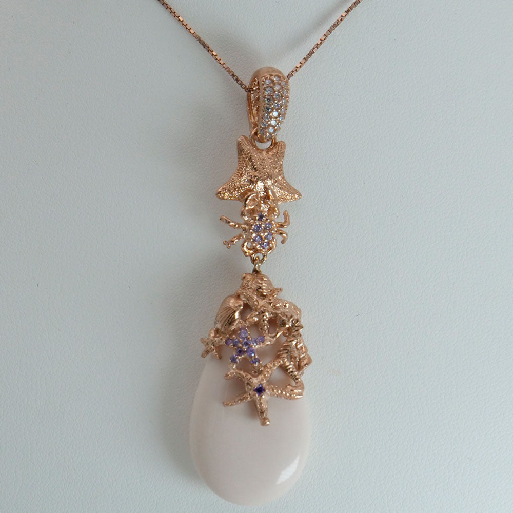 Collana in argento rosato con zirconi e pasta di corallo