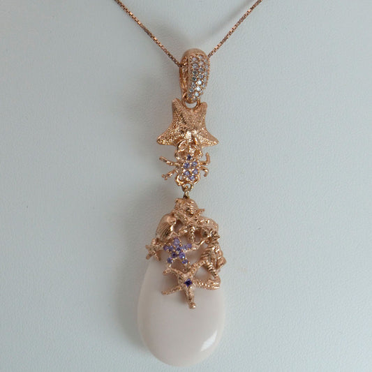 Collana in argento rosato con zirconi e pasta di corallo