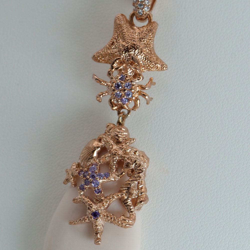 Collana in argento rosato con zirconi e pasta di corallo